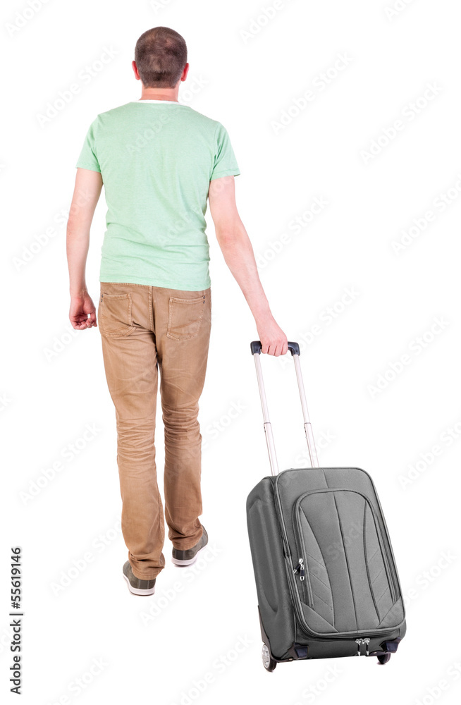 back view of walking man with suitcase. back view of walking man with suitcase.