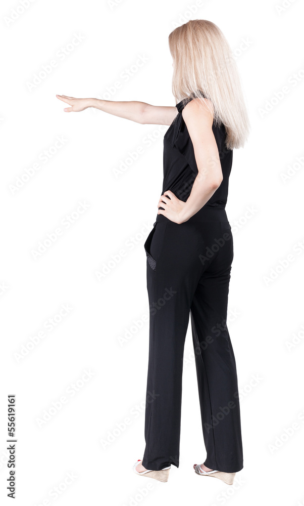 Back view of pointing woman. Back view of pointing woman.