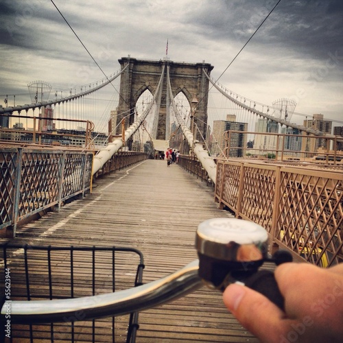 Driving bicycle across the brooklyn bridge photo