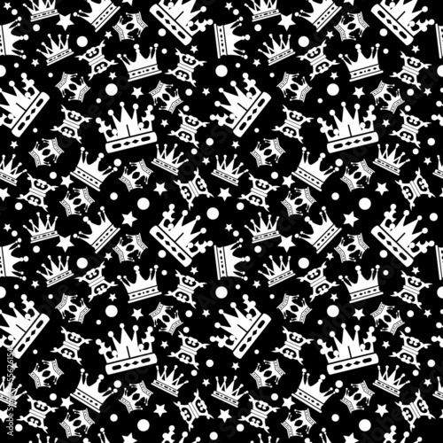 Seamless pattern with crowns on a black background for your design. White royal crowns on a dark background in a chaotic order. Vector image vector graphic