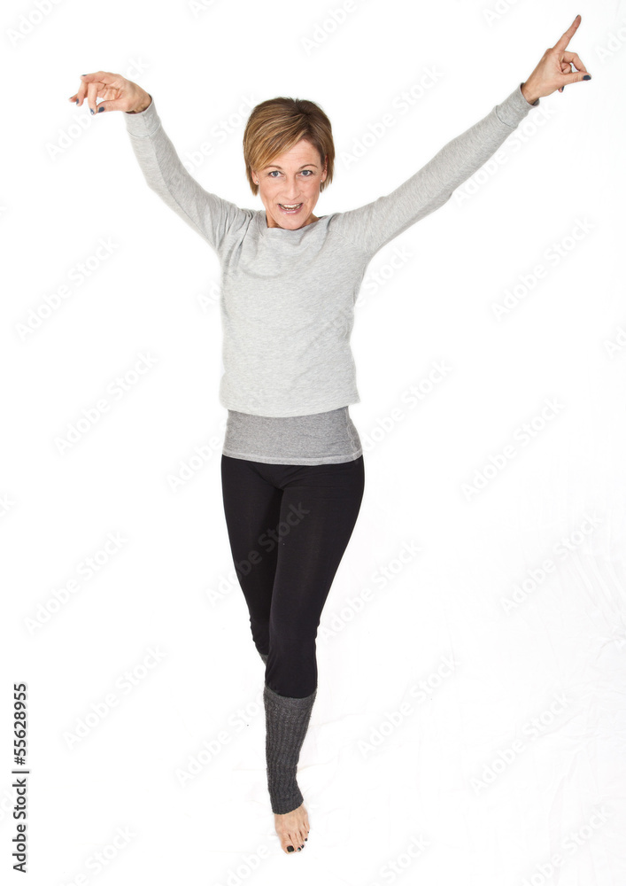 Cute woman standing and dancing on isolated white background Cute woman standing and dancing on isolated white background