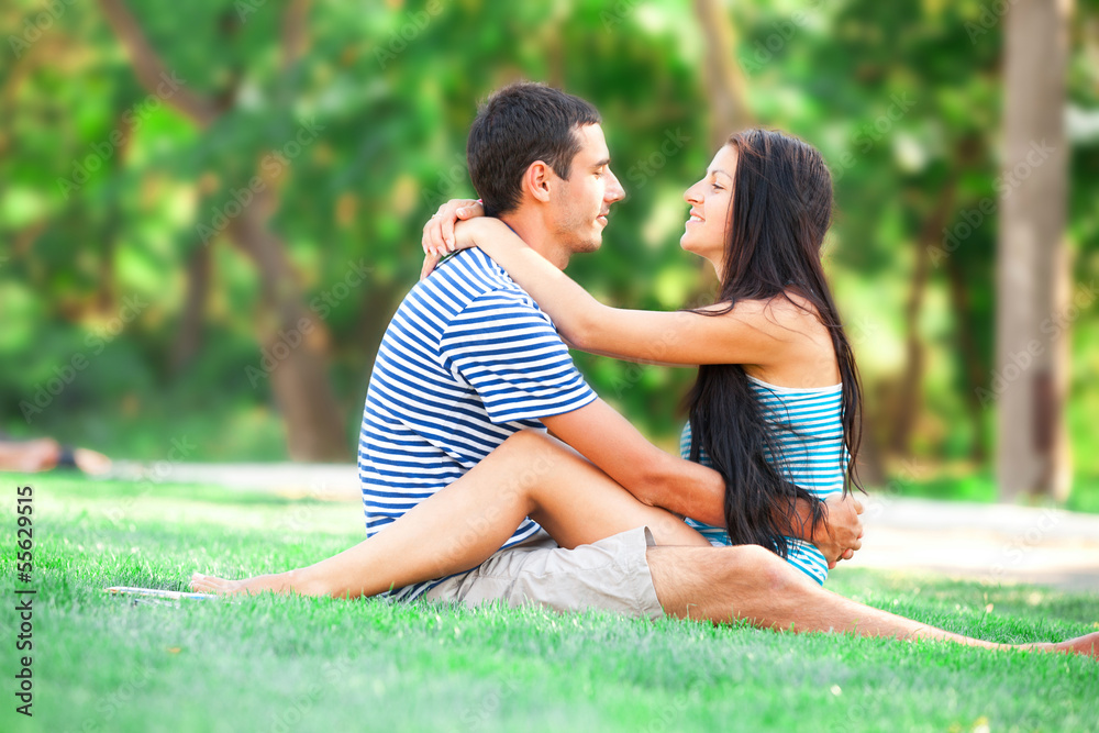 Fototapeta premium Young teen couple kissing at outdoor