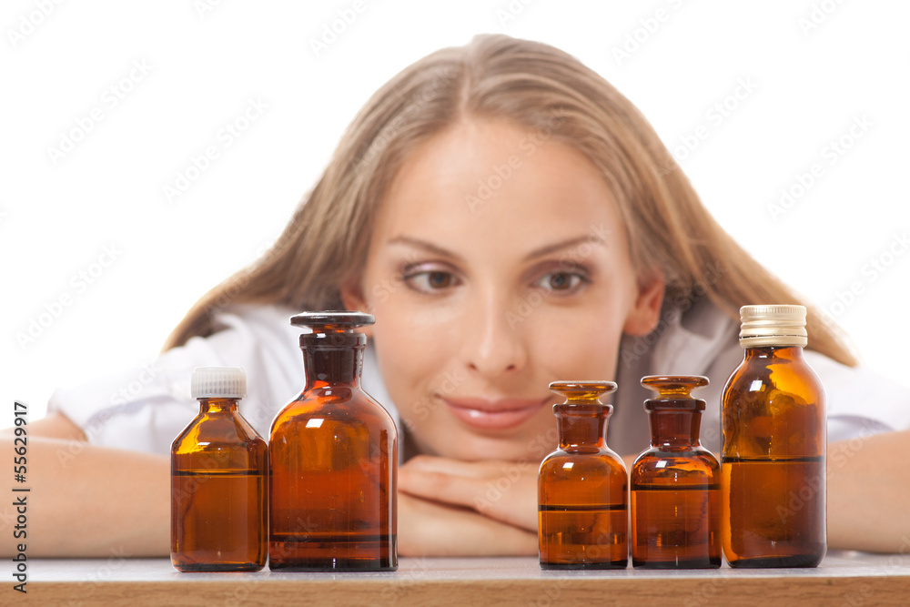 woman doctor with medication in glass bottles woman doctor with medication in glass bottles