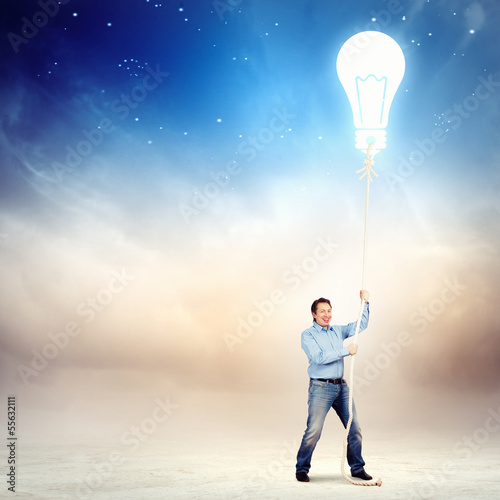 Adult man pulling rope with a bulb