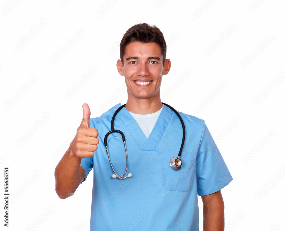 Smiling nurse in uniform gesturing positive sign Smiling nurse in uniform gesturing positive sign