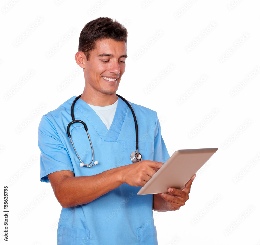 Charming nurse in uniform working on tablet pc Charming nurse in uniform working on tablet pc