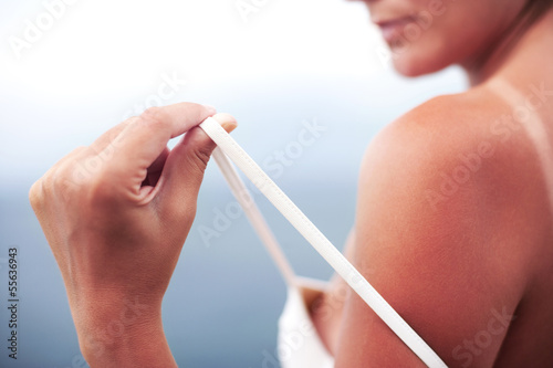 Severely burned skin, dark tanned body