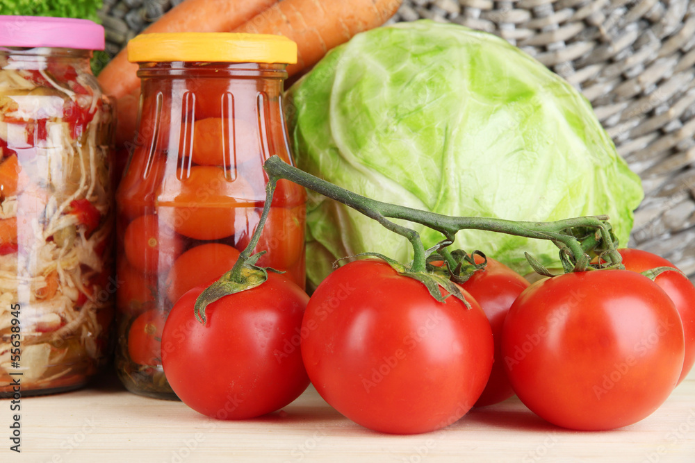 Fresh vegetables and canned on table close up