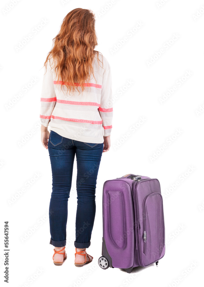 back view of walking woman with suitcase. back view of walking woman with suitcase.