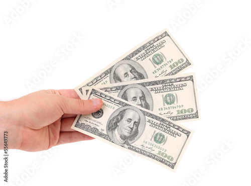 Male hand holding american Dollar-bills.