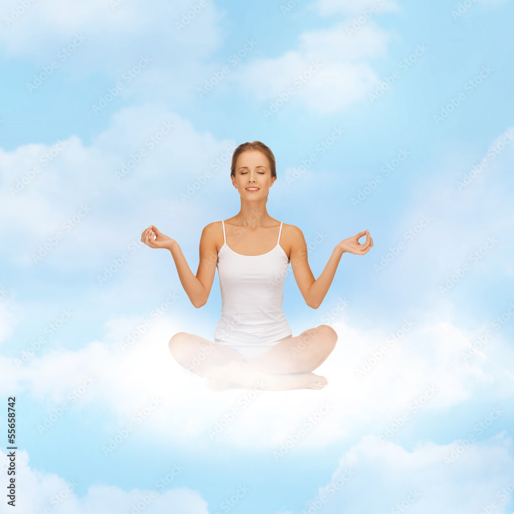 girl sitting in lotus position and meditating girl sitting in lotus position and meditating