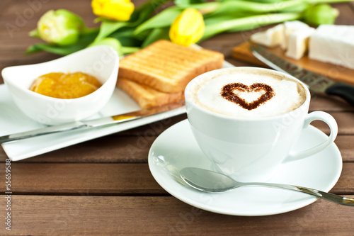 cup of coffee, cheese, toasted bread and mango jam