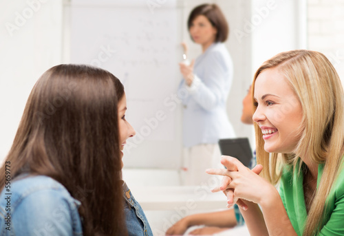 student girls gossiping at school