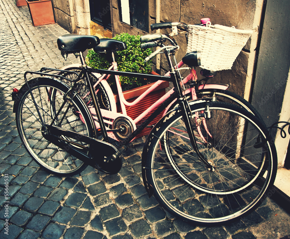 Two classic vintage retro city bicycles, retro tinted photo, Rom