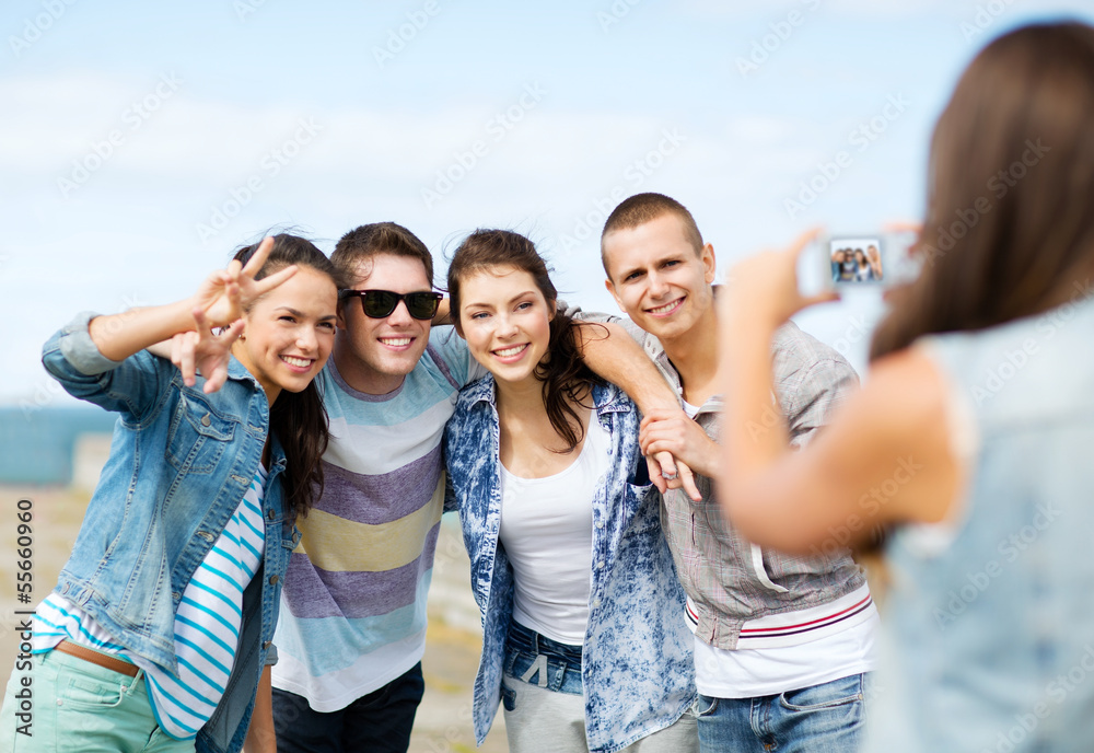 teenagers taking photo outside teenagers taking photo outside