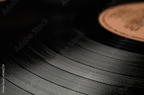 Segment of vinyl record with label showing the texture of the gr