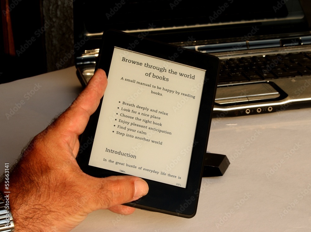Trend - ebook reader in front of laptop - obrazy, fototapety, plakaty 