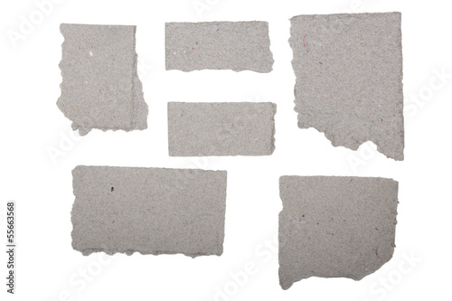 ripped grey crumpled pieces of cardboard isolated on white