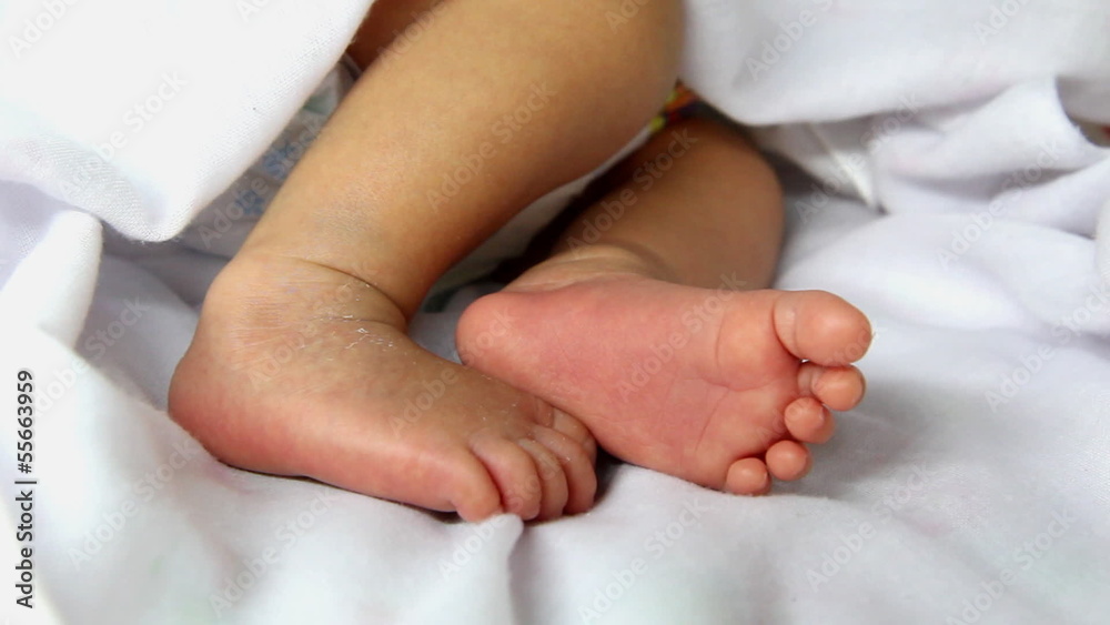 Closeup to cute newborn baby's feet , one week age Closeup to cute newborn baby's feet , one week age