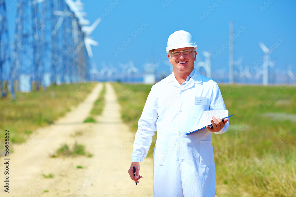 researcher analyzes readouts on wind power station researcher analyzes readouts on wind power station