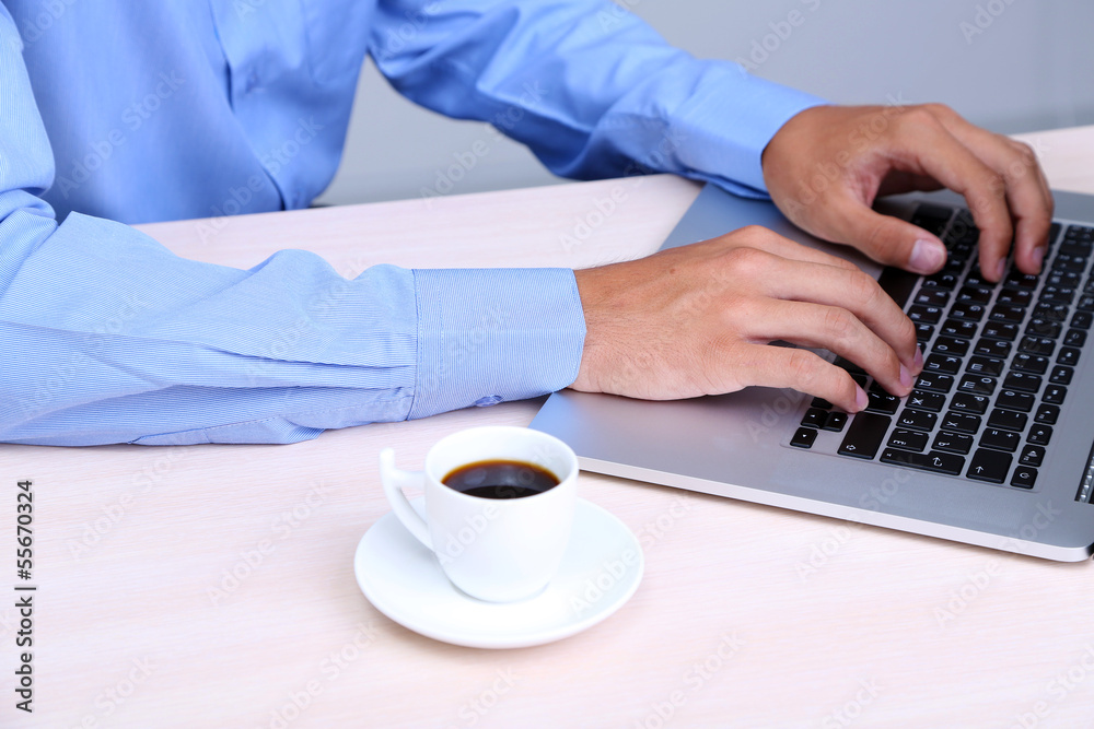 Businessman with notebook in office close-up Businessman with notebook in office close-up