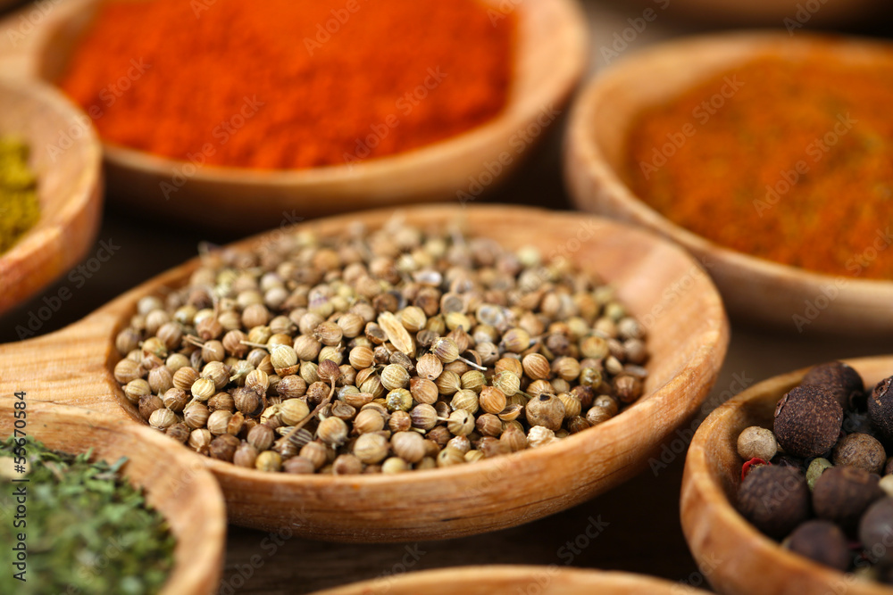 Assortment of spices in wooden spoons, close-up Assortment of spices in wooden spoons, close-up