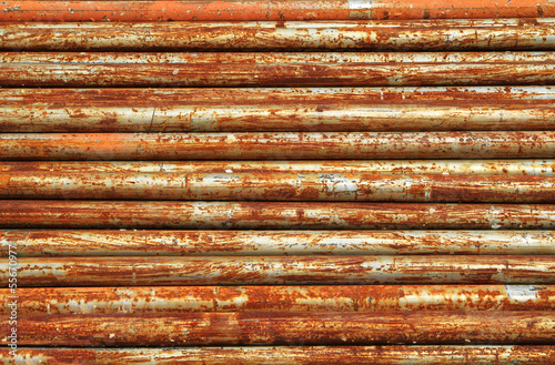 Stack of rusty metal pipes