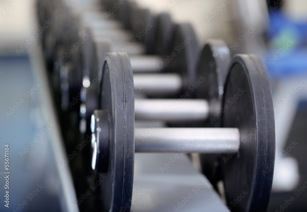 Lot of dumbbells in gym close-up Lot of dumbbells in gym close-up
