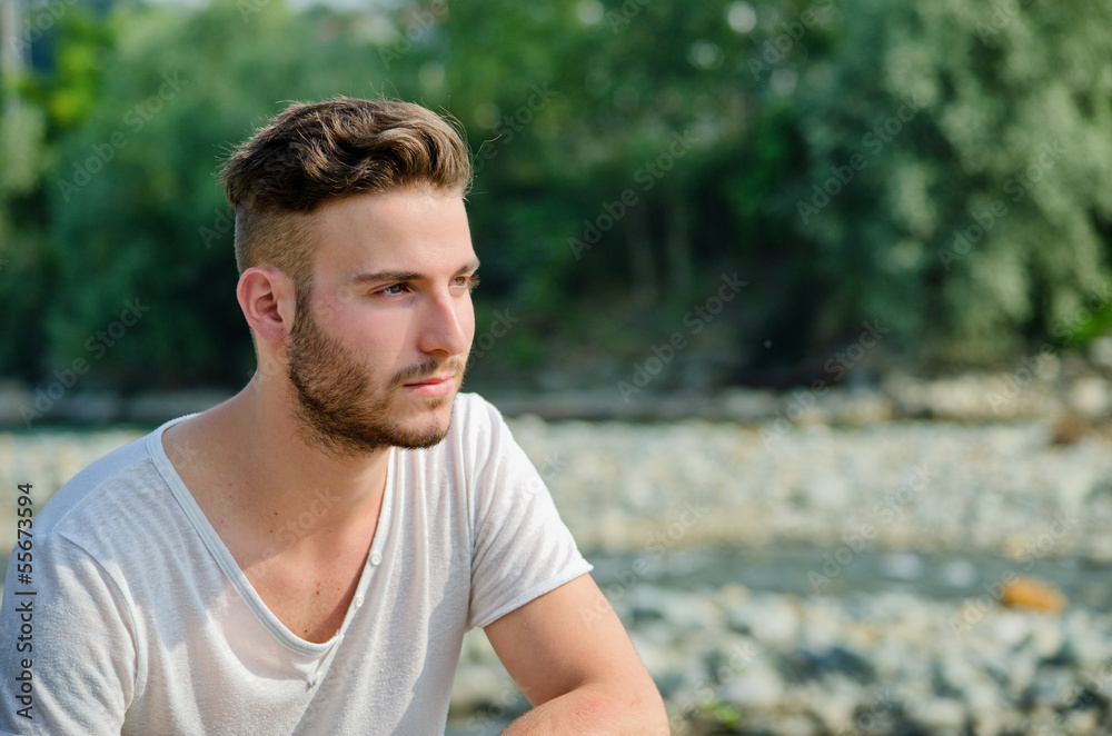 Portrait of handsome young man outdoors in nature Portrait of handsome young man outdoors in nature