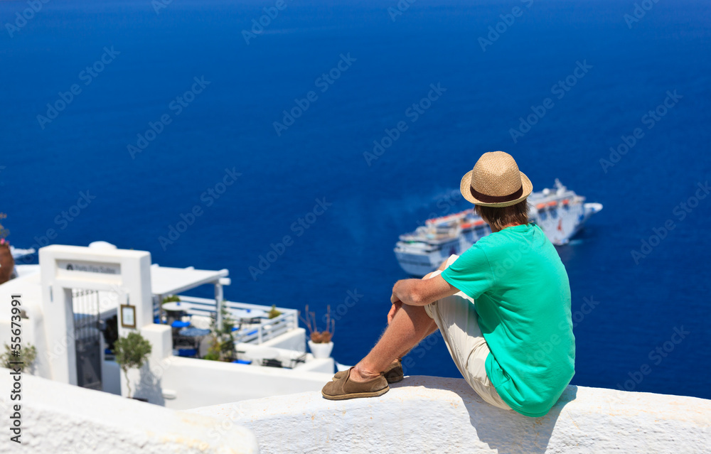 tourist looking at the sea in Santorini