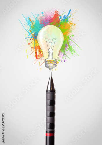 Pen close-up with colored paint splashes and lightbulb photo