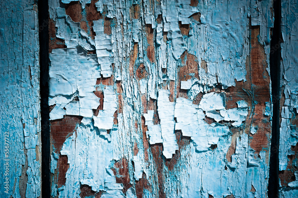 Old cracked paint on wooden wall. Grunge background