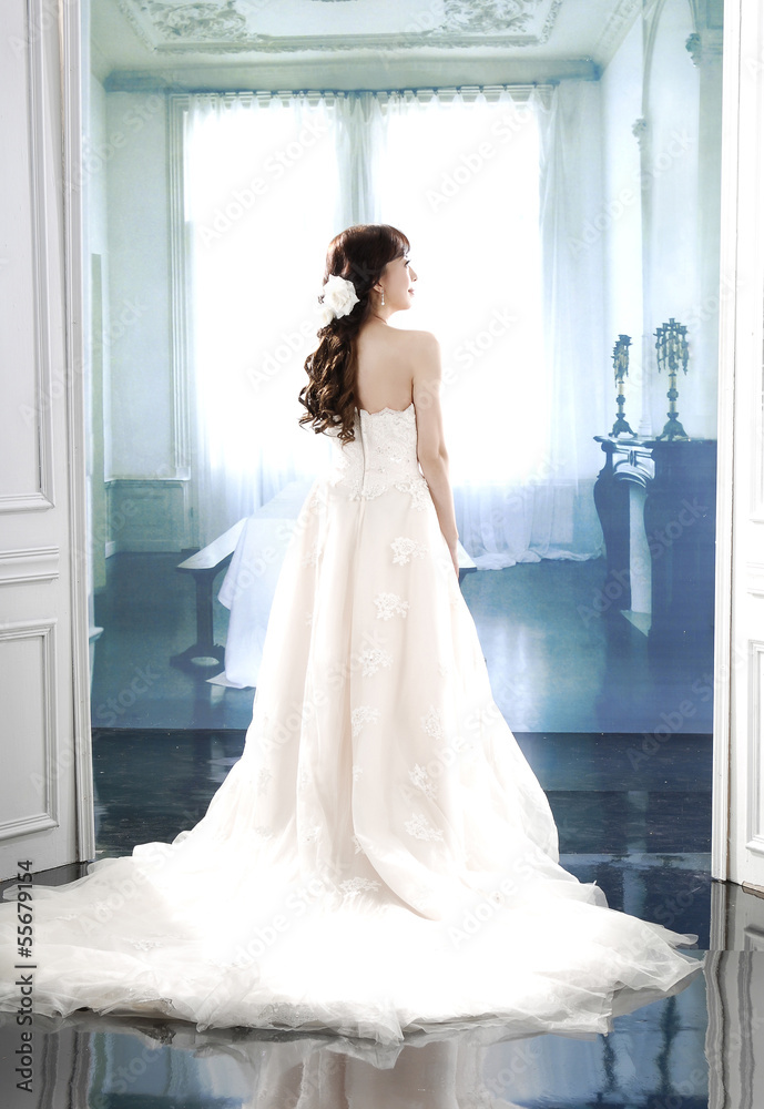 young and beautiful bridge in white dress back young and beautiful bridge in white dress back