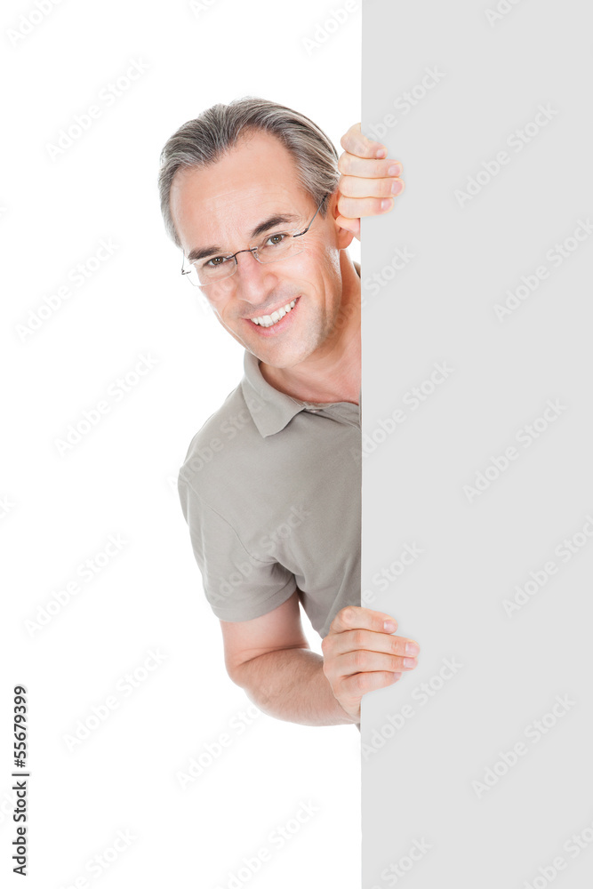 Happy Mature Man Standing Behind Placard Happy Mature Man Standing Behind Placard