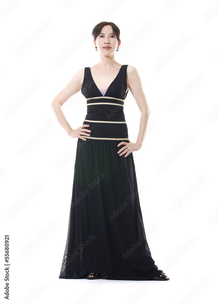 Beautiful model posing in evening dress over light background
