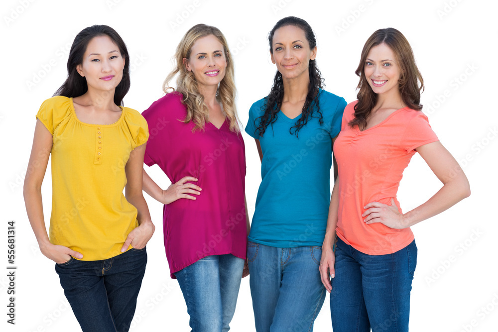 Cheerful models posing with hands on hips Cheerful models posing with hands on hips