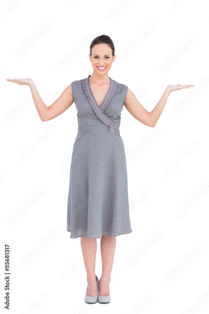 Cheerful elegant woman in classy dress posing hands up Cheerful elegant woman in classy dress posing hands up