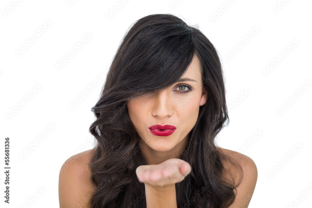 Sexy brunette with red lips blowing kiss to camera Sexy brunette with red lips blowing kiss to camera