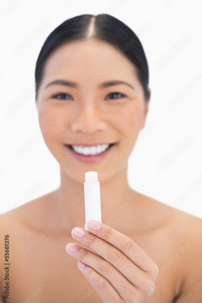 Cheerful gorgeous natural model holding chap stick Cheerful gorgeous natural model holding chap stick