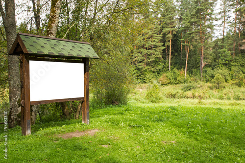 Blank wooden billboard in the forest