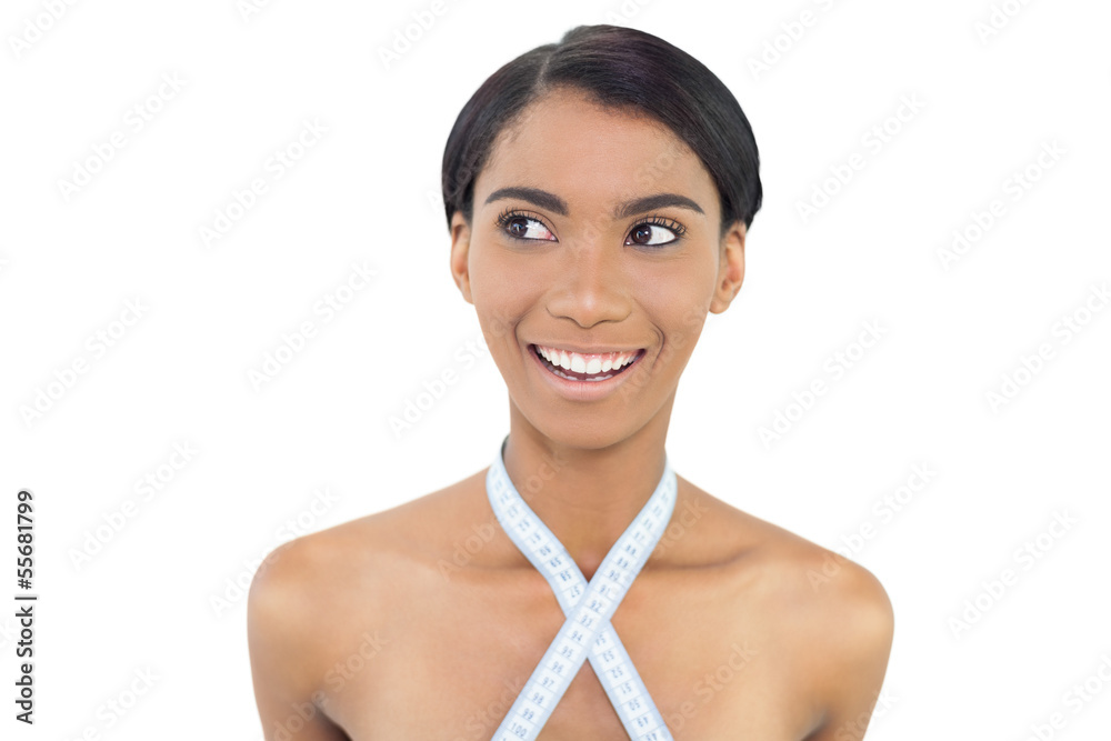 Smiling natural model with measuring tape around her neck Smiling natural model with measuring tape around her neck