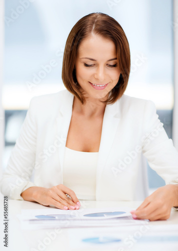 businesswoman working with graphs in office