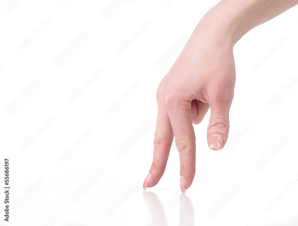 Gesturing. Close-up of female hand gesturing while isolated on w Gesturing. Close-up of female hand gesturing while isolated on w