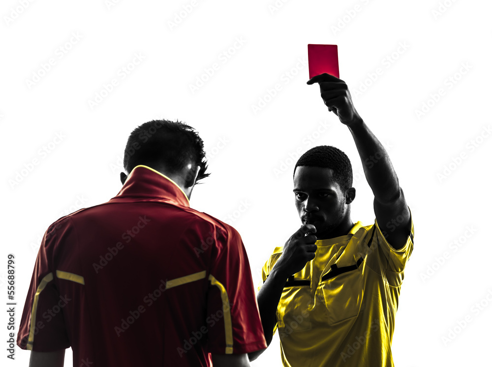Obraz premium two men soccer player and referee showing red card silhouette