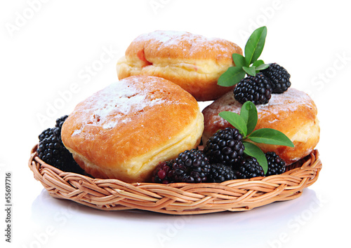 Tasty donuts with berries, isolated on white