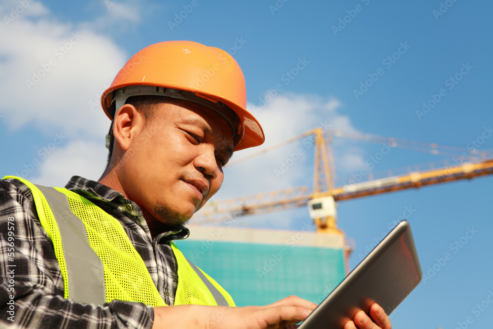 construction worker using digital tablet construction worker using digital tablet