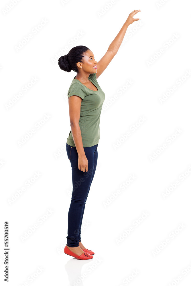 young african girl reaching something high young african girl reaching something high