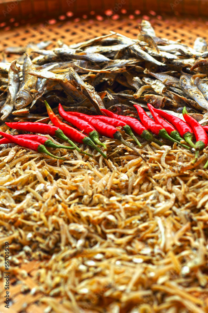 Dry fish in the market and chili red.