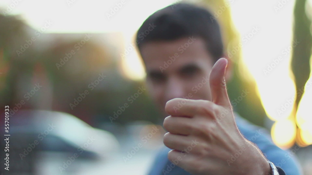 Thumb up, unrecognizable young man outdoors, like, take, buy