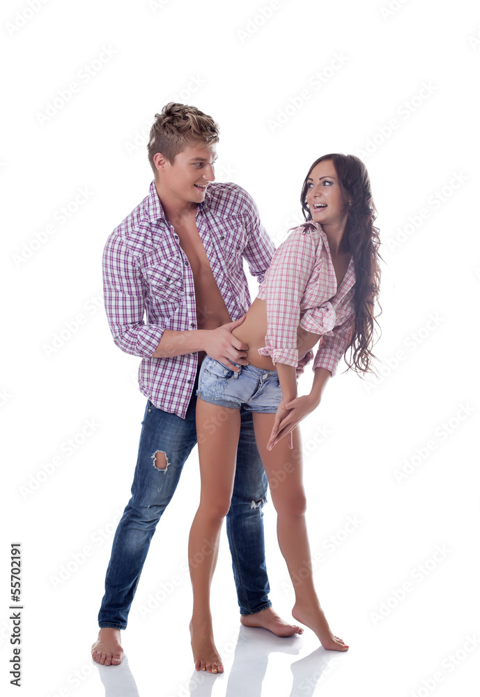 Playful young couple smiling at each other Playful young couple smiling at each other